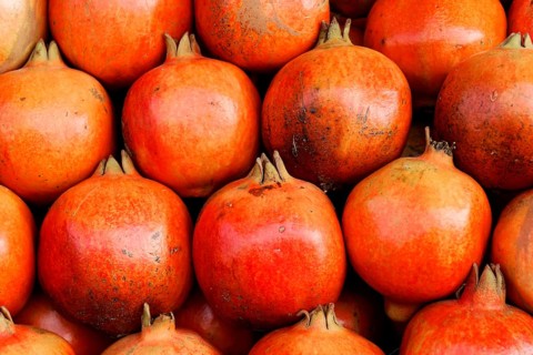 Kota, Rajasthan, North India, Asia, Ripe, red pomegranates close together, with a smooth surface