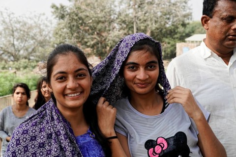 Kota, Rajasthan, North India, Asia, Two smiling woman with headscarves pose friendly in nature,