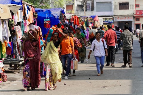 Kota, Rajasthan, North India, Asia, Lively market with people of different ages between colourful