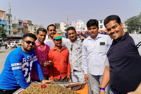 Kota, Rajasthan, North India, Asia, Group of men in sunny weather in an urban environment,