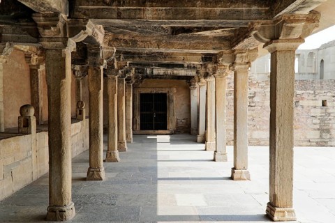 Kota, Rajasthan, North India, Asia, An old stone colonnade full of shadow and light, part of a