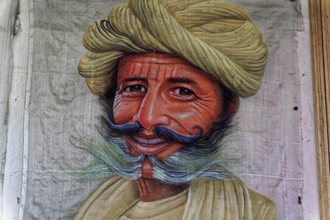 Painting, Sale, Souvenir, Udaipur, Rajasthan, India, Asia, Portrait painting of a man with smiling