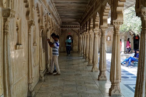 City Palace, Udaipur, Rajasthan, India, Asia, A long corridor decorated with stone carvings and
