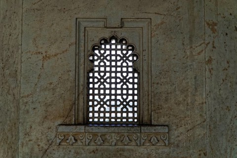 City Palace, Udaipur, Rajasthan, India, Asia, Decorated window with lattice pattern in a stone
