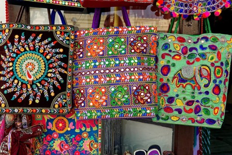 Udaipur, Rajasthan, North India, Asia, Three colourful bags with traditional patterns and elephant