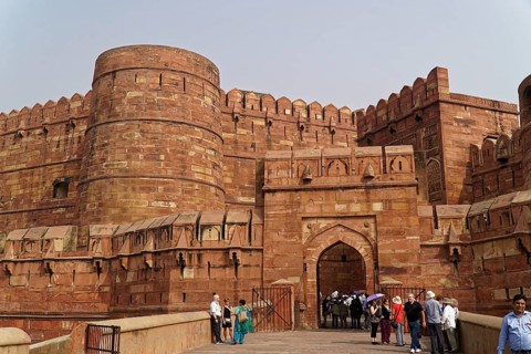Red Fort, Agra, Uttar Pradesh, India, Historic fortress gate with visitors and battlements,