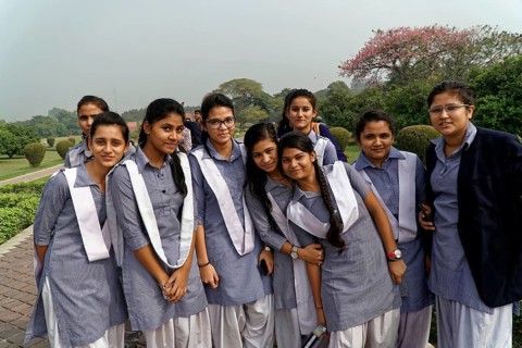 Agra, Jodhpur, Rajasthan, North India, Asia, A group of cheerful girls in uniforms poses smiling in