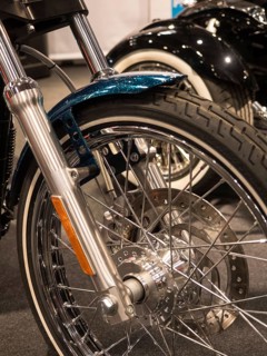 Front wheel of a classic motorbike with chrome rim and wire spokes, dortmund, deutchland