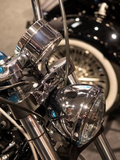 Chrome headlights with detailed wiring on a classic motorbike, dortmund, deutchland
