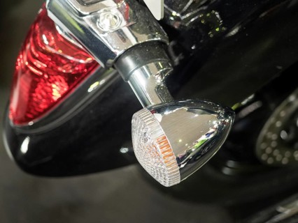 Detailed view of a motorbike tail light and indicator in chrome with black paint, dortmund,