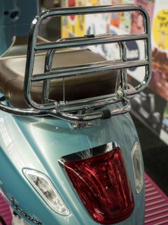 Blue scooter with chrome luggage rack and brown seat in retro design, dortmund, deutchland