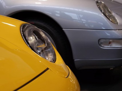 Details of yellow and silver Porsche showing headlights and luxurious design, Cologne, Germany