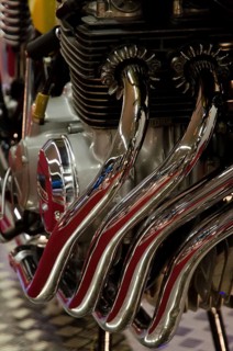 Close-up of shiny metal pipes and engine parts with a focus on mechanical beauty, dortmund, germany