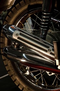Close-up of a chrome exhaust and tyre of a retro-style motorbike, dortmund, germany