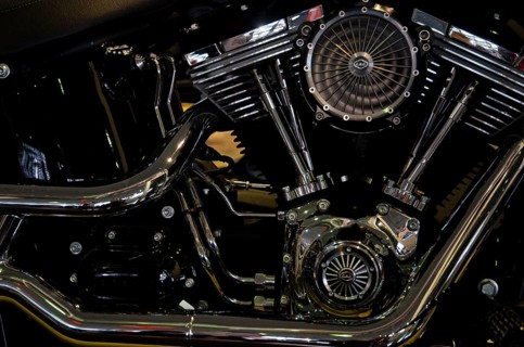 Close-up of a shiny motorbike engine block with visible valves and fan, dortmund, germany
