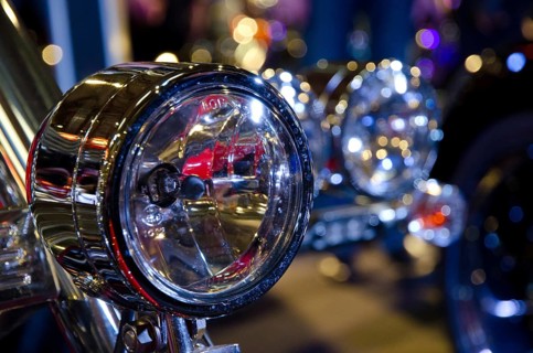 Shiny chrome headlights of a motorbike with light-reflecting backdrop, dortmund, germany