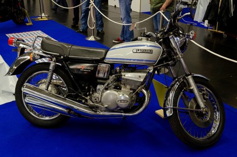 Retro Suzuki motorbike GT550 in blue with chrome details exhibited at a fair, dortmund, germany
