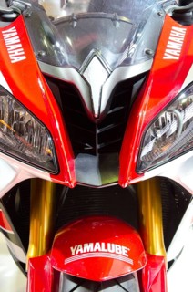 Sporty Yamaha motorbike in red and white colour with distinctive headlights and logos, dortmund,