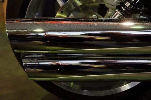 Close-up of a chrome-plated motorbike exhaust with shiny surface and reflections, dortmund, germany