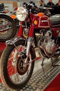 Classic red Honda motorbike with lots of chrome elements in a showroom, dortmund, germany