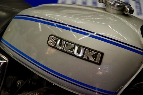 Detailed view of a Suzuki motorbike tank with blue stripes, dortmund, germany