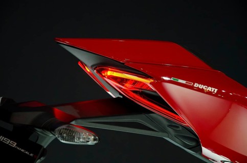 Side view of a Ducati motorbike rear end with red tail light, dortmund, germany