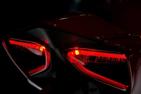 Red tail lights of a motorbike in dark surroundings, modern design, dortmund, germany