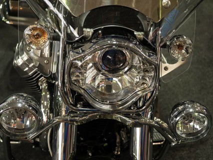 Close-up of a shiny chrome headlight on a motorbike, dortmund, germany