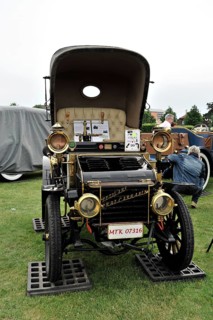 Petigars Prat Carrabi Voiturette, built in 1898, classic car, black and gold vintage car in an