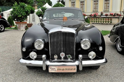 Shiny black Bentley classic car with striking headlights and classic front, Retro Classics meets