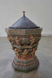 Historic baptismal font from 1539 with inscription, decorations and relief, interior view, arts and