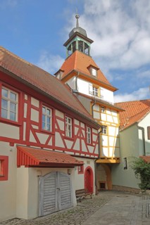 Fortified church, town hall from behind and town musicians' tower, gate tower, half-timbered house,