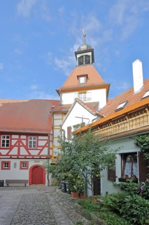 Fortified church with town musician tower and town hall from behind, gate tower, half-timbered