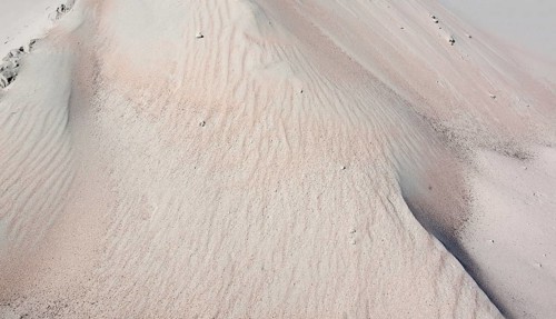 Full frame abstract sand background in sunny ambiance