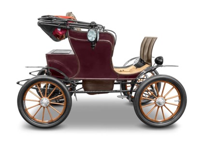 Sideways shot of a old historic electric car isolated in white back with shadow
