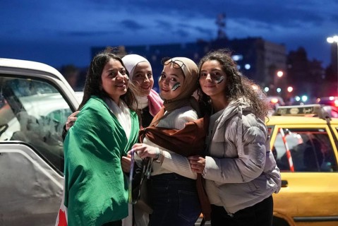 Thousands of Syrians take to public squares and main streets waving the revolutionary flag and