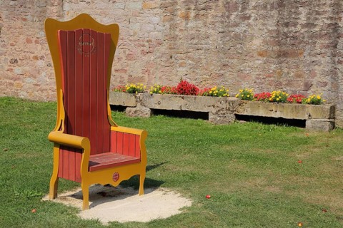 Red golden throne in the inner courtyard, garden, museum, Brothers Grimm House, Steinau an der