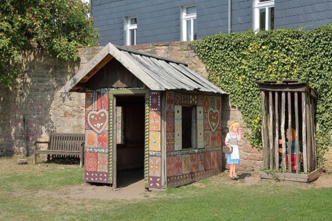 Gingerbread house for the fairy tale Hansel and Gretel, fairy tale figures, hut, wooden posts,