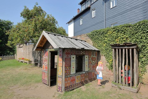 Gingerbread house for the fairy tale Hansel and Gretel, fairy tale figures, hut, wooden posts,