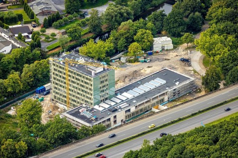Aerial view, Arnsberg town hall on the A46 motorway, construction site with new building, Neheim,