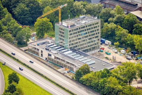 Aerial view, Arnsberg town hall on the A46 motorway, construction site with new building, Neheim,