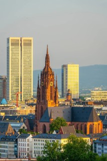 Frankfurt Cathedral, Residential Buildings and City at Sunrise. Aerial View. Golden Hour. Hesse,