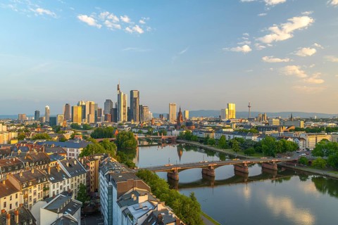 Frankfurt City Downtown, Residential Buildings, Bridges and Main River at Sunrise. Wide Shot.