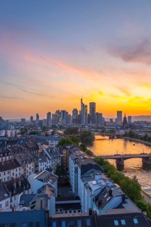 Frankfurt City Downtown, Residential Buildings, Bridges and Main River at Fiery Colorful Sunset.