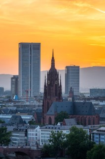 Frankfurt Cathedral, Residential Buildings and City at Fiery Sunset. Gothic Church. Aerial View.
