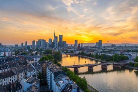 Frankfurt City Skyline, Residential Buildings, Bridges and Main River at Fiery Colorful Sunset.
