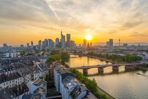 Frankfurt City Downtown, Residential Buildings, Bridges and Main River at Sunset. Wide Shot. Aerial
