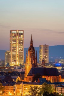 Illuminated Frankfurt Cathedral, Residential Buildings and City at Night. Aerial View. Blue Hour.