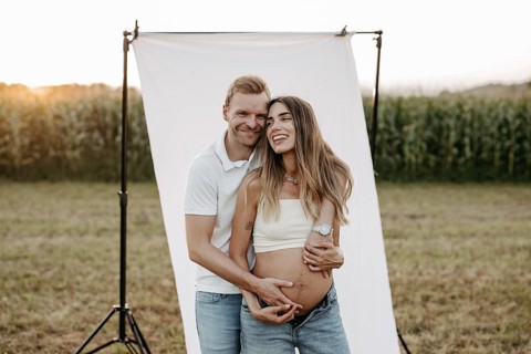 Pregnant, young woman with partner