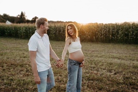 Pregnant, young woman with partner